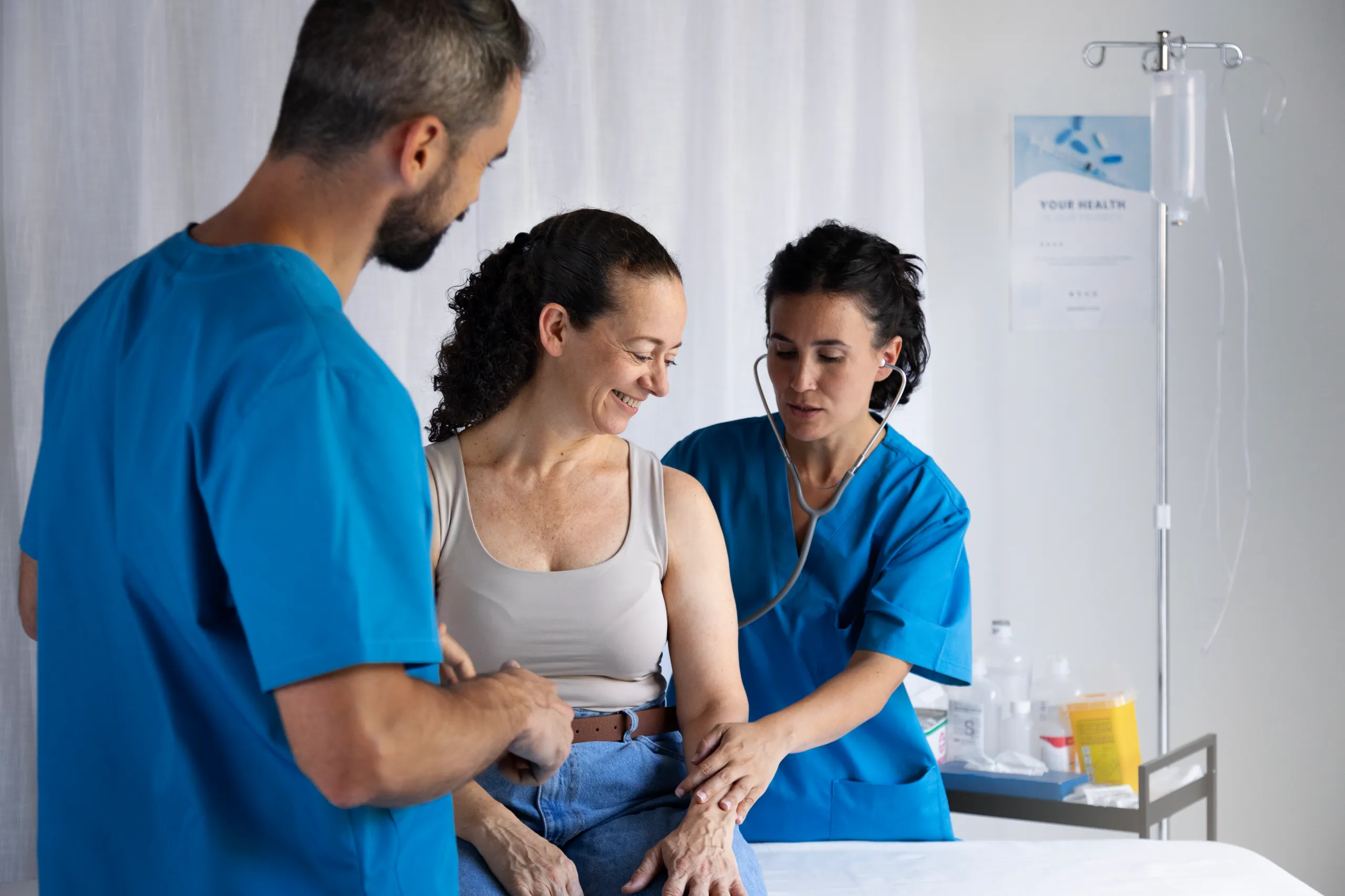 CNA students receiving supervised clinical training from a nursing instructor