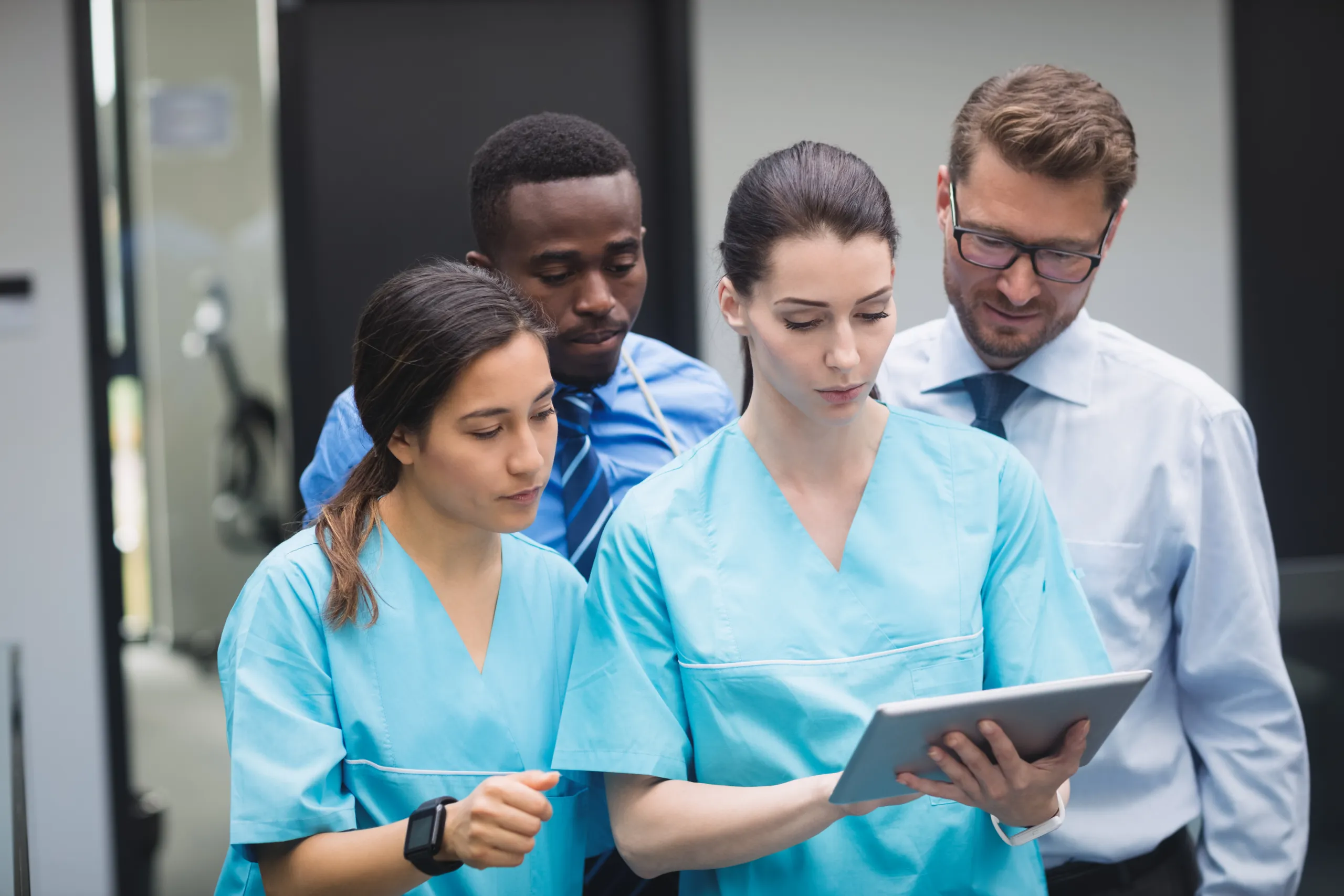 Healthcare students learning patient care skills during training